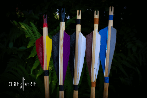 Handmade wooden arrows with colorful fletching